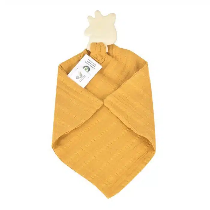 backside of giraffe teether and muslin cloth